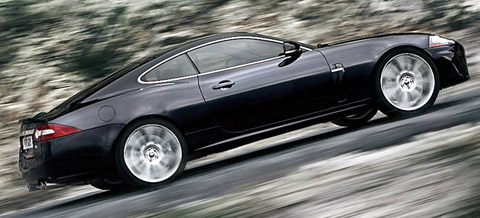 2010 Jaguar XKR black driving up hill